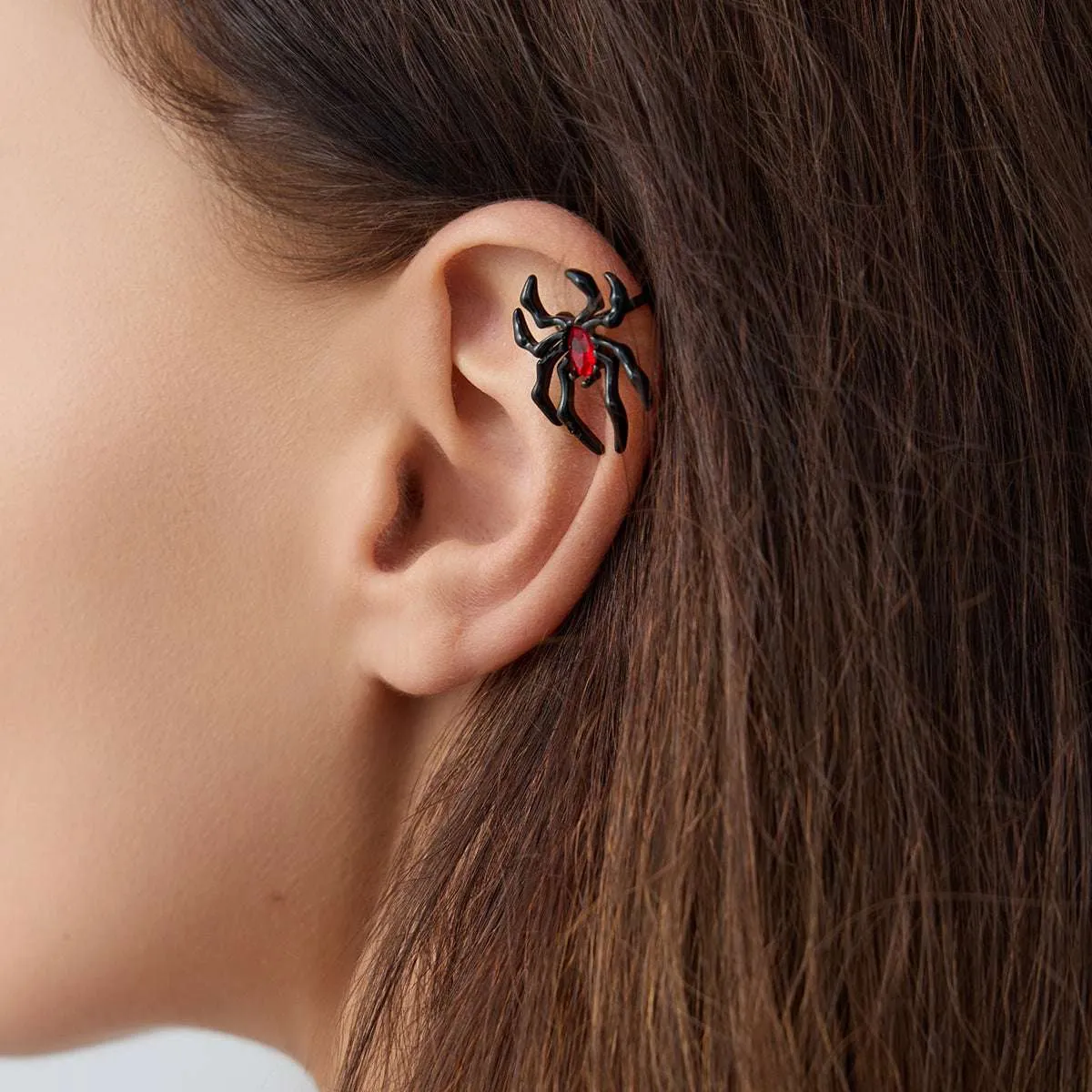 Red Crystal & Blacktone Spider Ear Cuff sold by Zulily