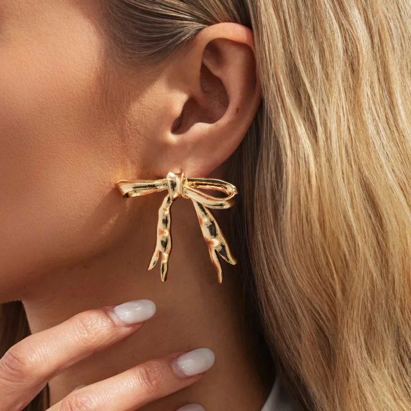 Goldtone Hammered Bow Stud Earrings made by Zulily