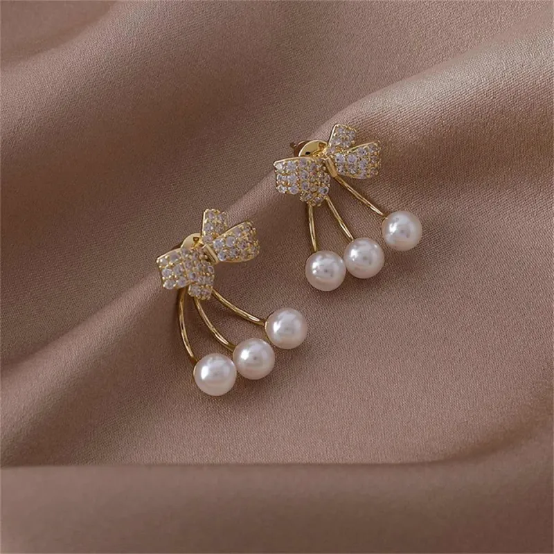 Cubic Zirconia & Pearl Goldtone Bow Ear Jackets made by Zulily