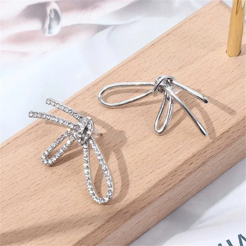 Cubic Zirconia & Silvertone Knot Stud Earrings made by Zulily