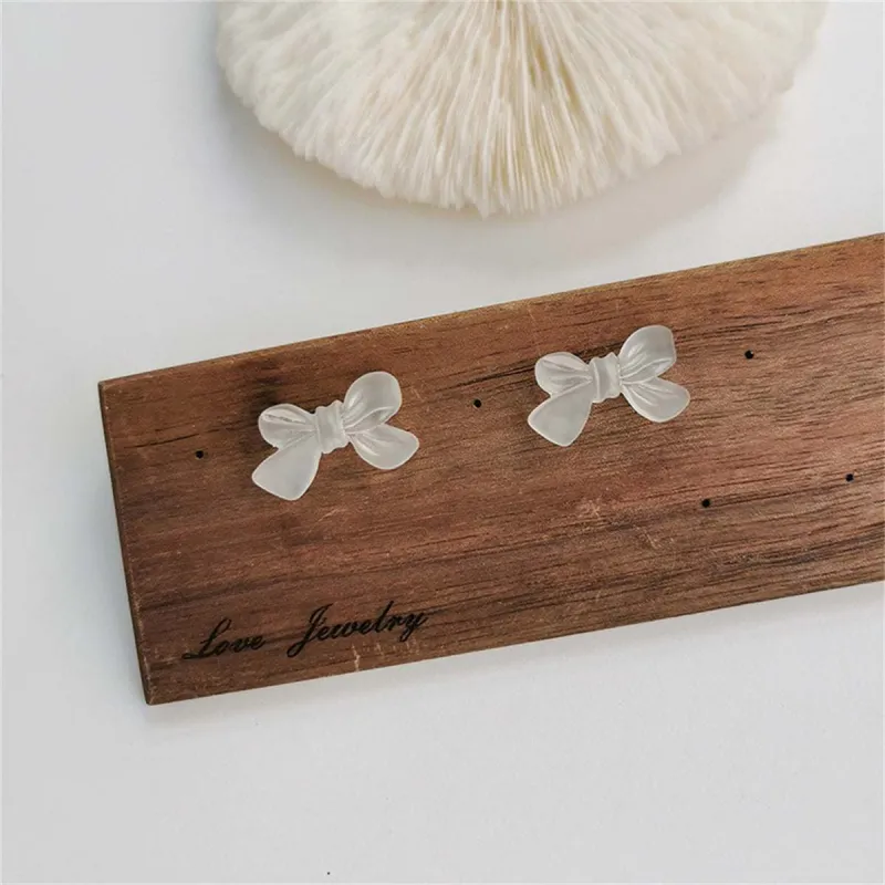 Frosted White Acrylic & Silvertone Bow Stud Earrings made by Zulily