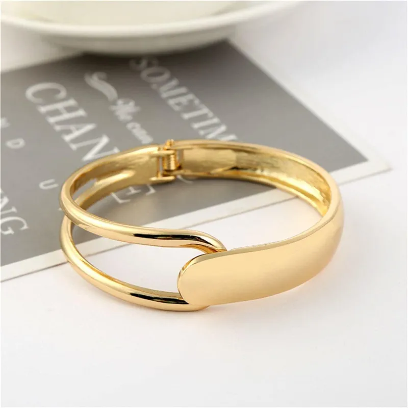 Goldtone Openwork Drop End Hinge Bangle made by Zulily