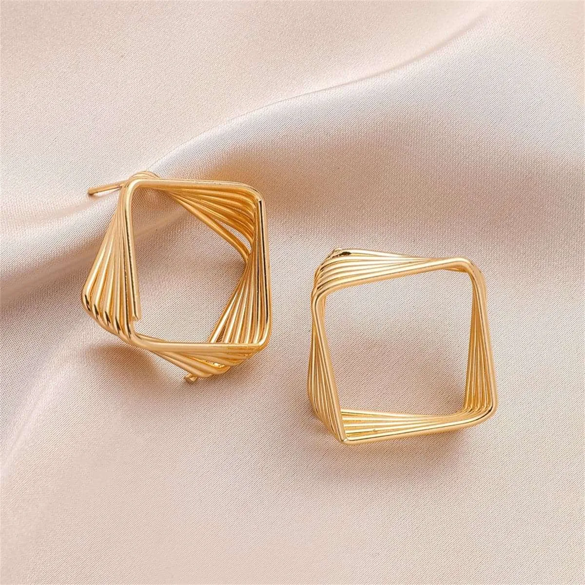 Goldtone Stacked Rhombus Drop Earrings sold by Zulily