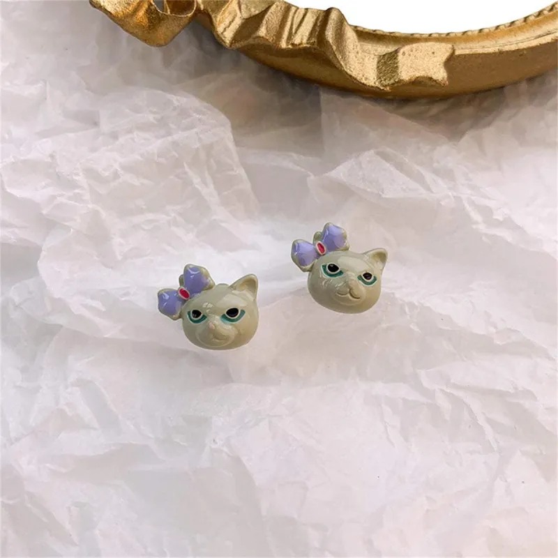 Gray & Silvertone Bow Kitty Stud Earrings made by Zulily