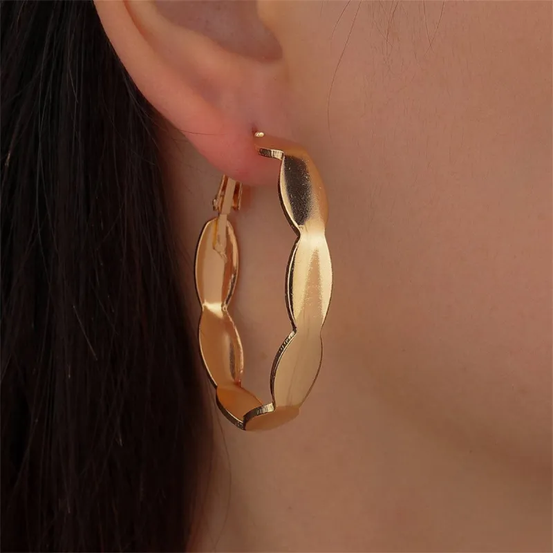 Goldtone Wave Hoop Earrings made by Zulily