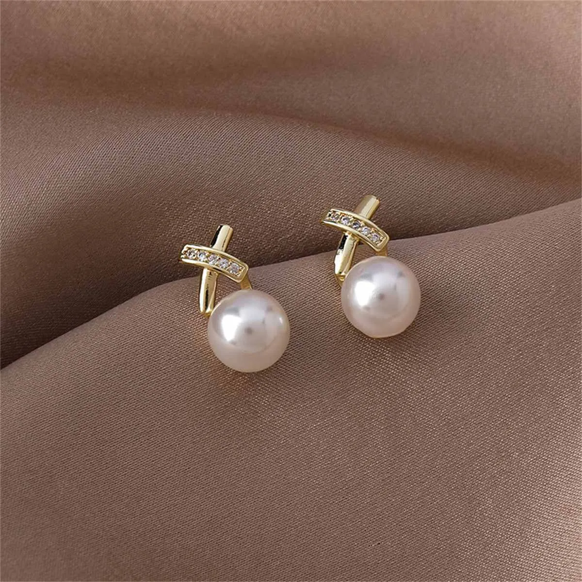 Pearl & Cubic Zirconia Pavé Crisscross Stud Earrings sold by Zulily