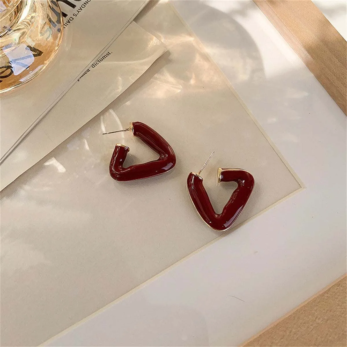 Red Enamel & Goldtone Open Triangle Huggie Earrings sold by Zulily