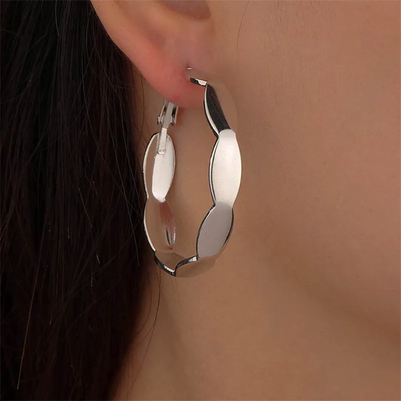 Silvertone Wave Hoop Earrings made by Zulily