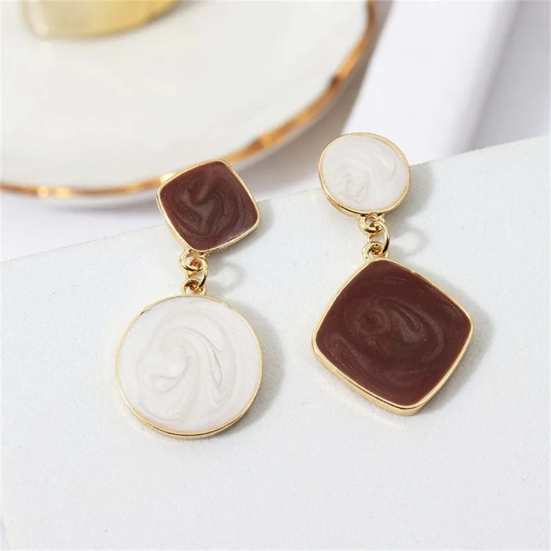 White & Brown Geometric Mismatched Drop Earrings made by Zulily