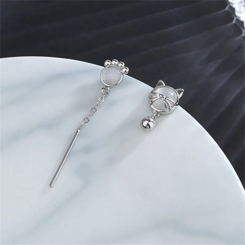 White Cat Eye & Silvertone Kitty Mismatching Drop Earrings made by Zulily