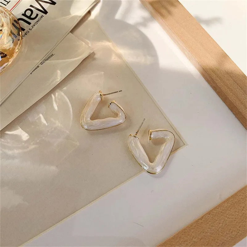 White Enamel & Goldtone Open Triangle Huggie Earrings made by Zulily
