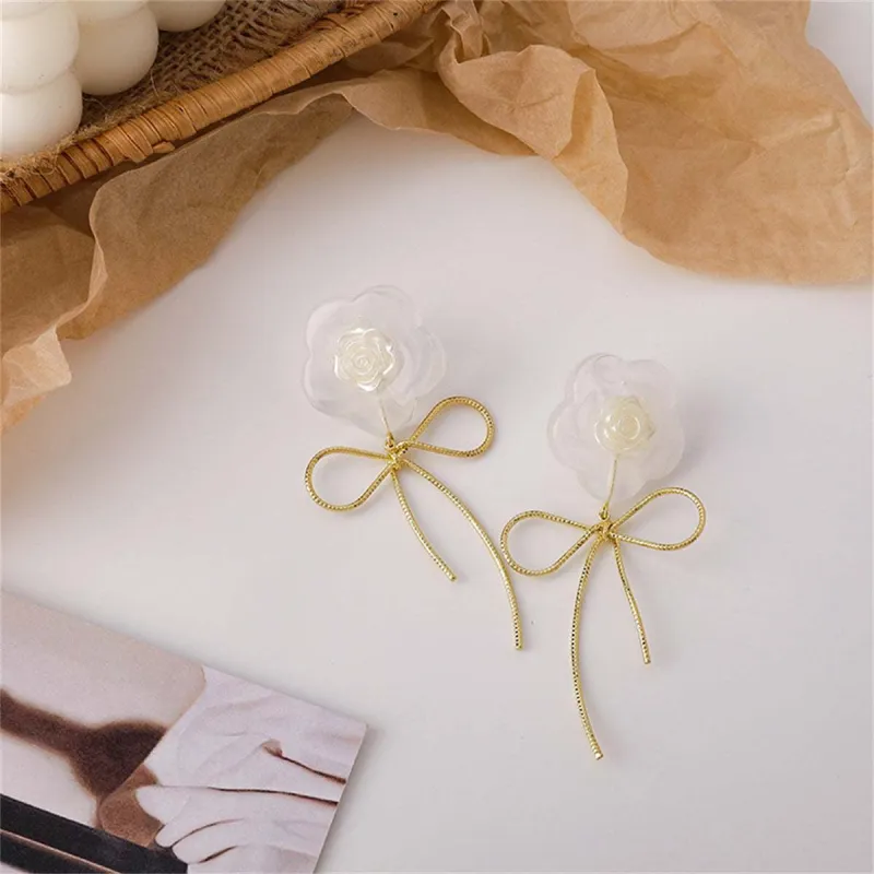 White Resin & Goldtone Flower Bow Drop Earrings made by Zulily