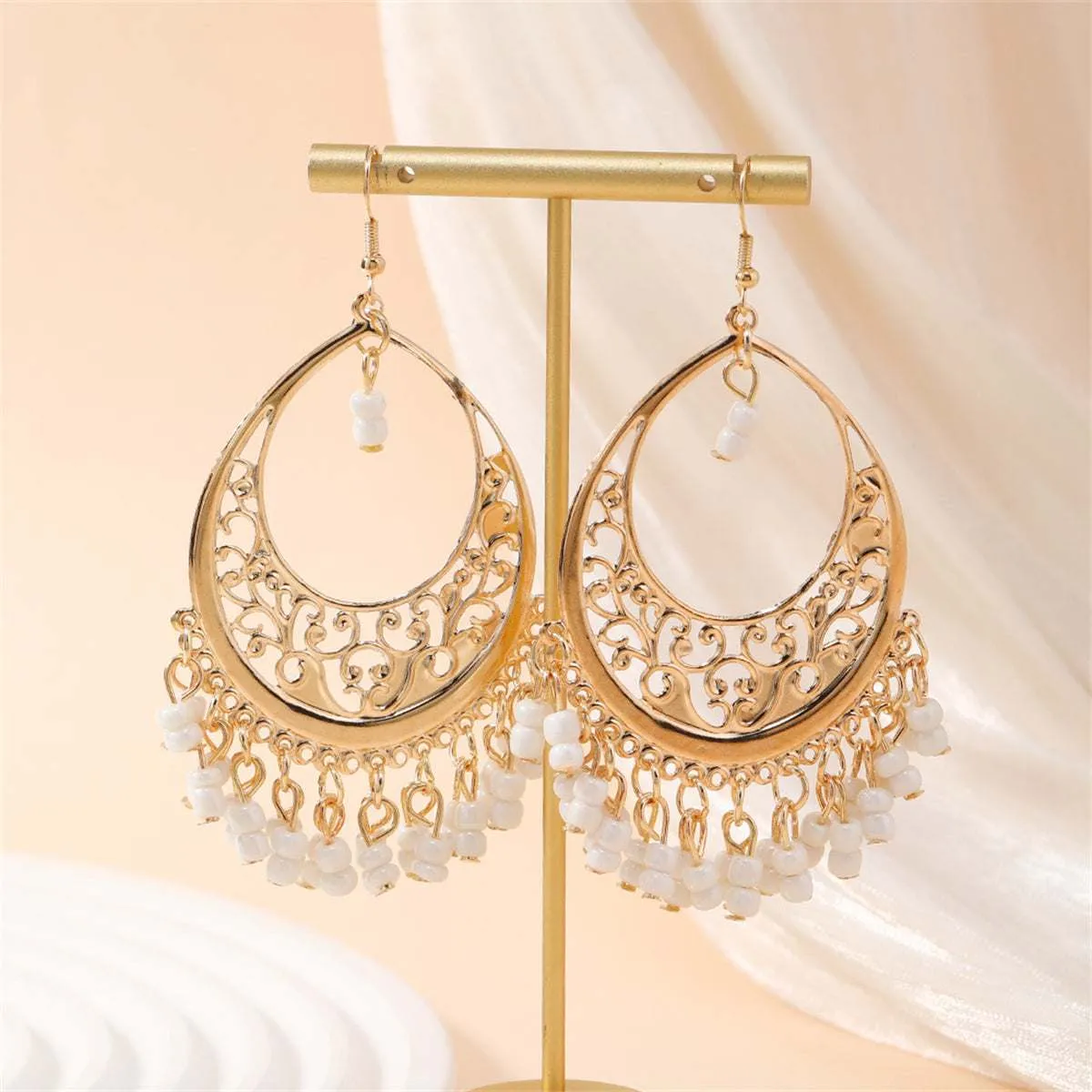 White Turquoise & Goldtone Openwork Filigree Drop Earrings sold by Zulily
