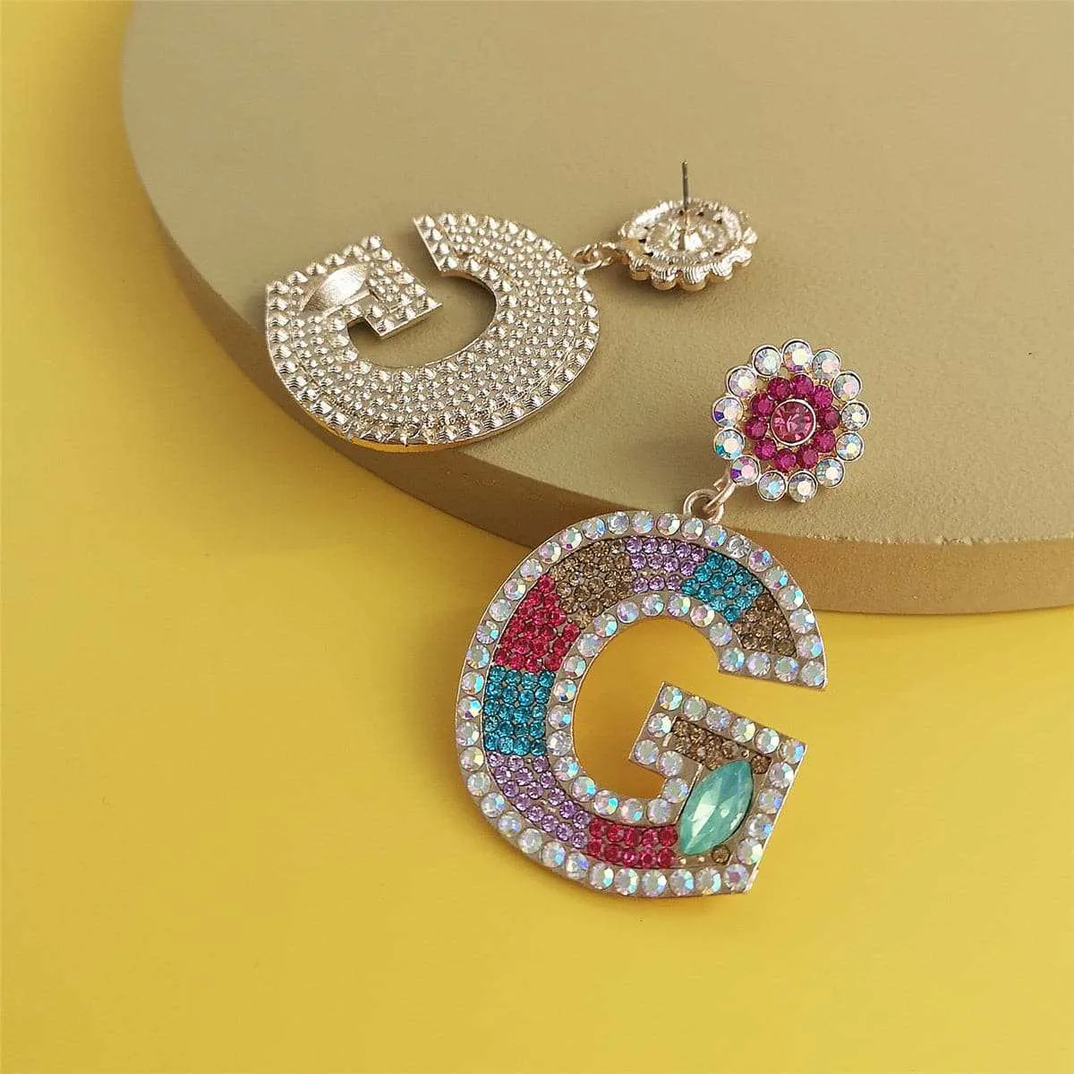 Blue & Pink Crystal & Cubic Zirconia 'G' Drop Earrings sold by Zulily