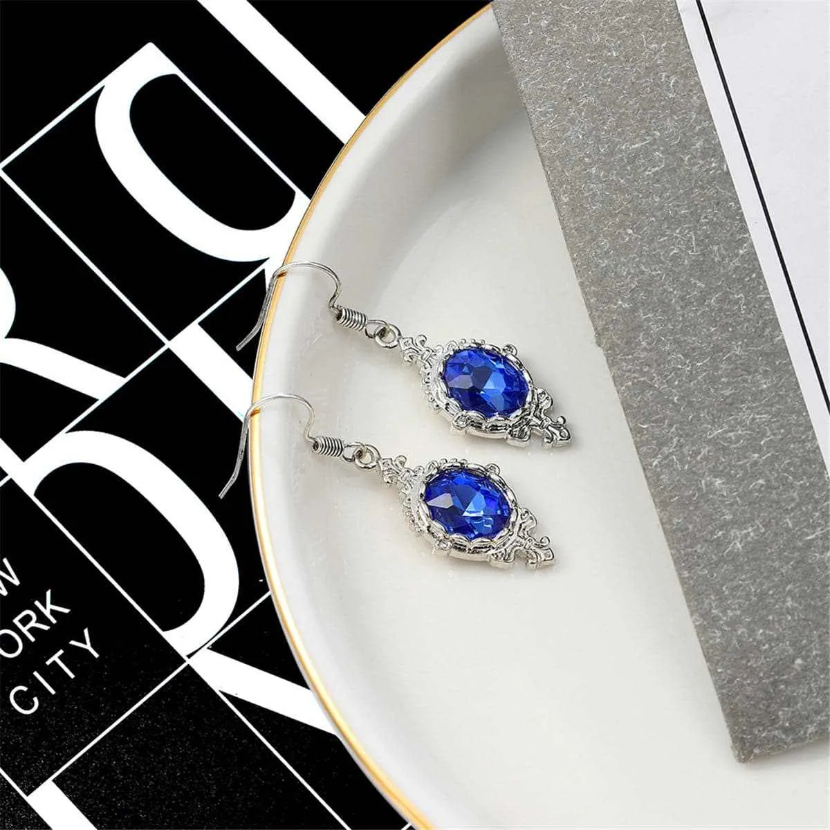 Blue Crystal & Silvertone Oval Engraved Drop Earrings sold by Zulily