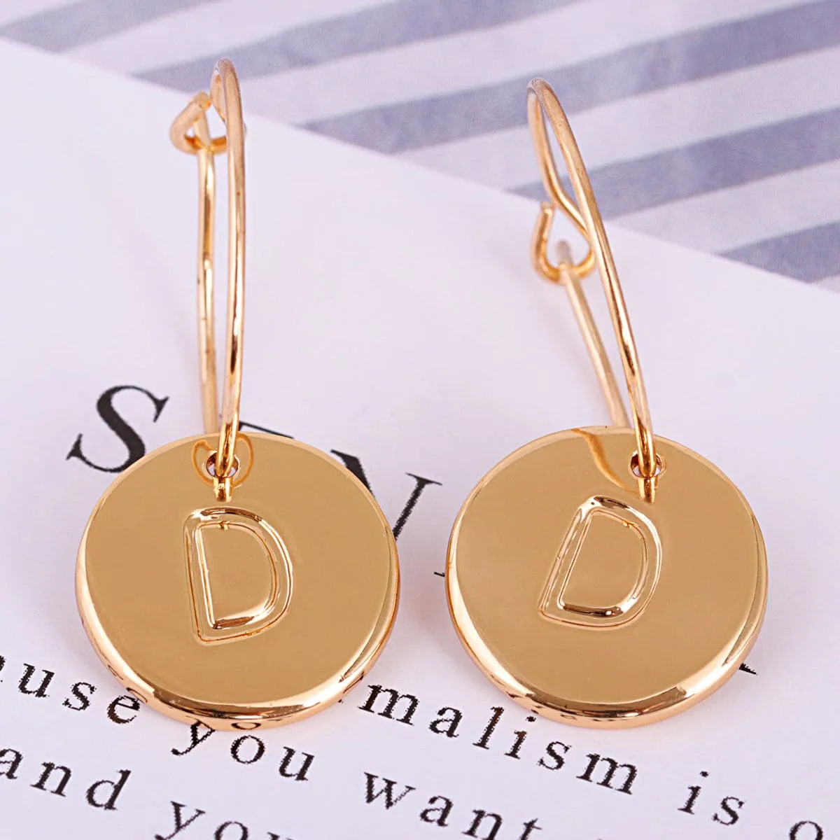 Goldtone Letter D Cut Drop Earrings sold by Zulily