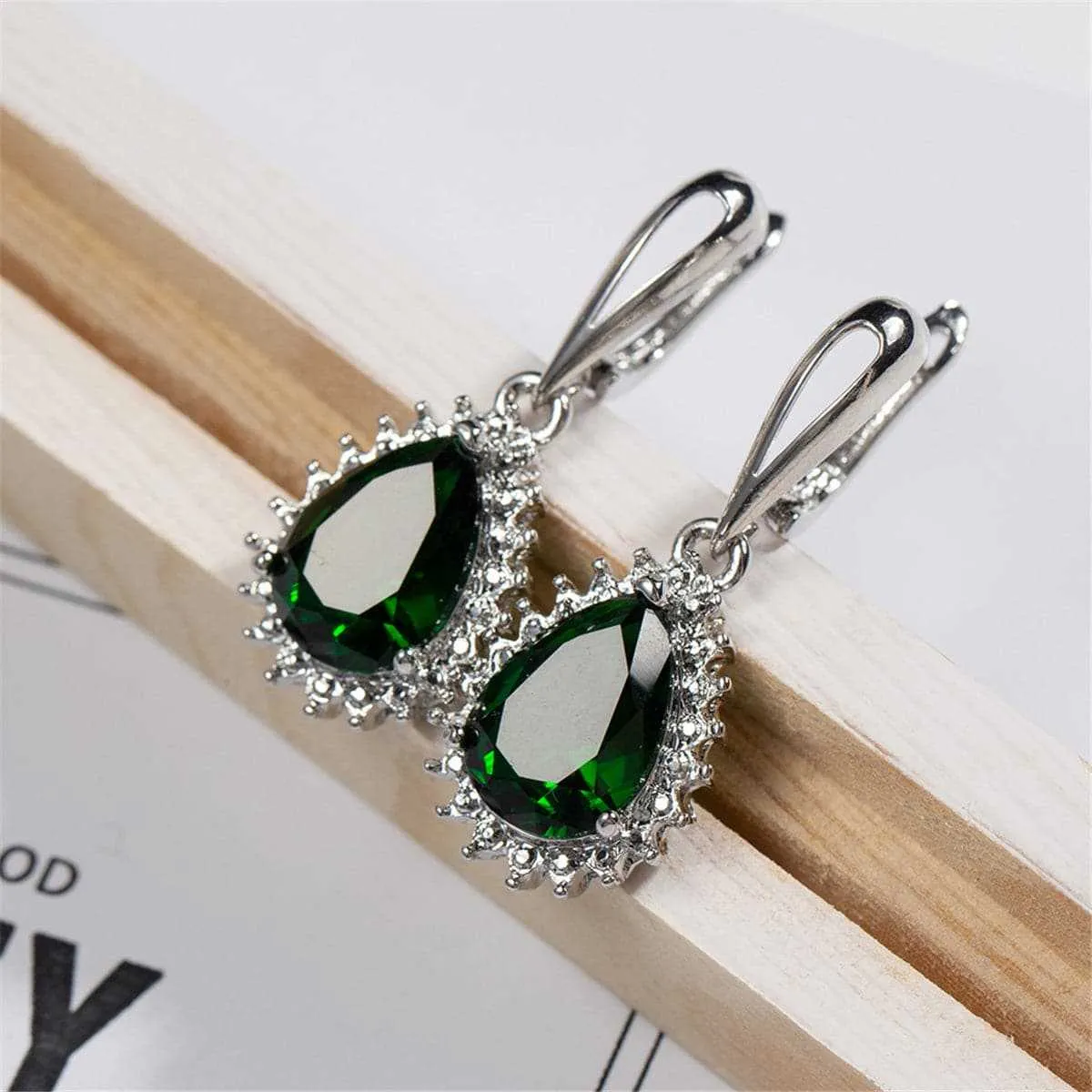 Green Crystal & Silvertone Pear-Cut Drop Earrings sold by Zulily