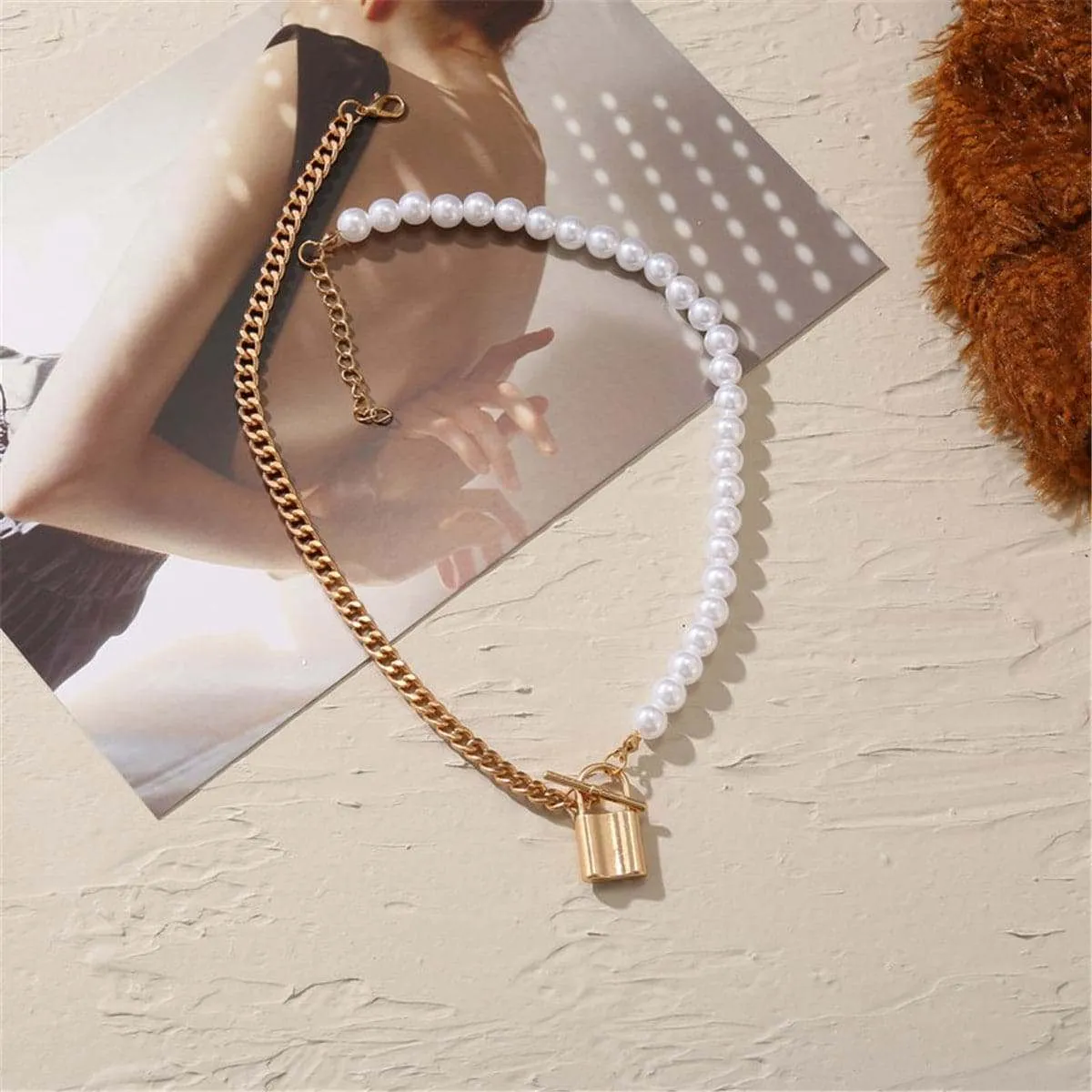 Pearl & Goldtone Lock Pendant Necklace sold by Zulily