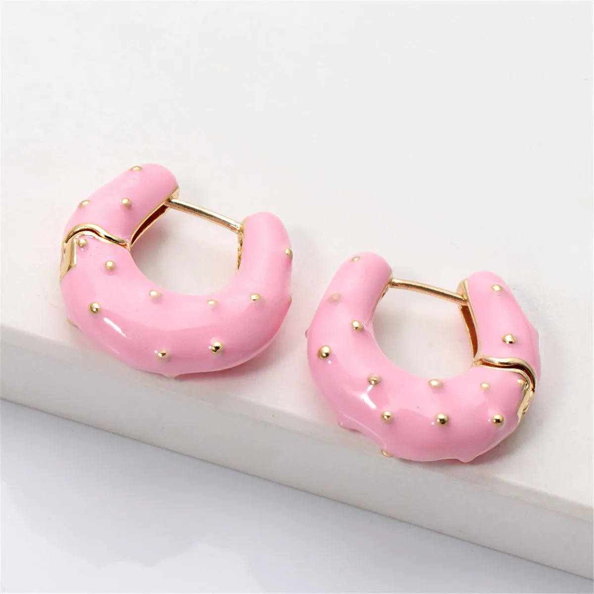 Pink Enamel & Goldtone Huggie Earrings sold by Zulily