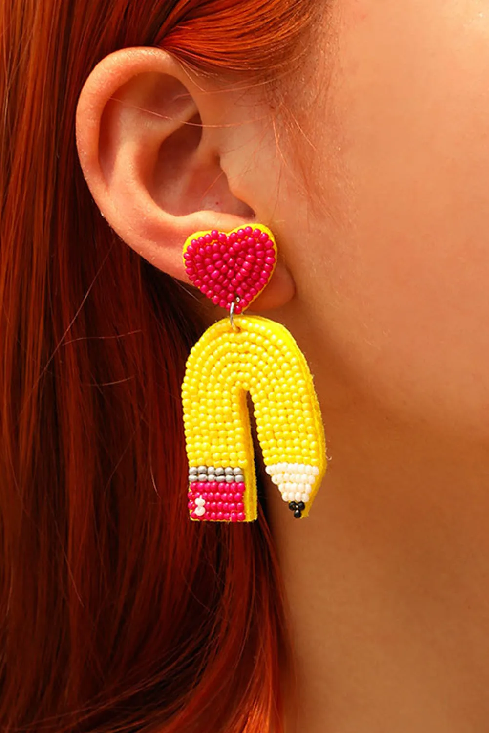 Yellow Heart Pencil Earrings sold by Zulily