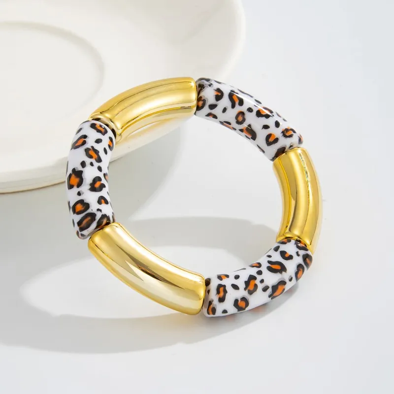 White Resin & Goldtone Cow Print Joint Stretch Bracelet made by Zulily