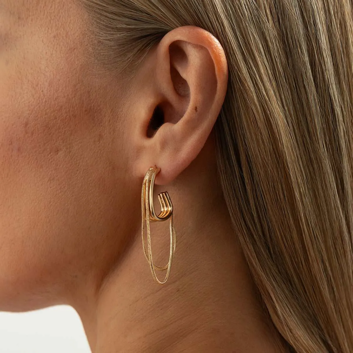 Goldtone Chain Tassel Huggie Earrings sold by Zulily