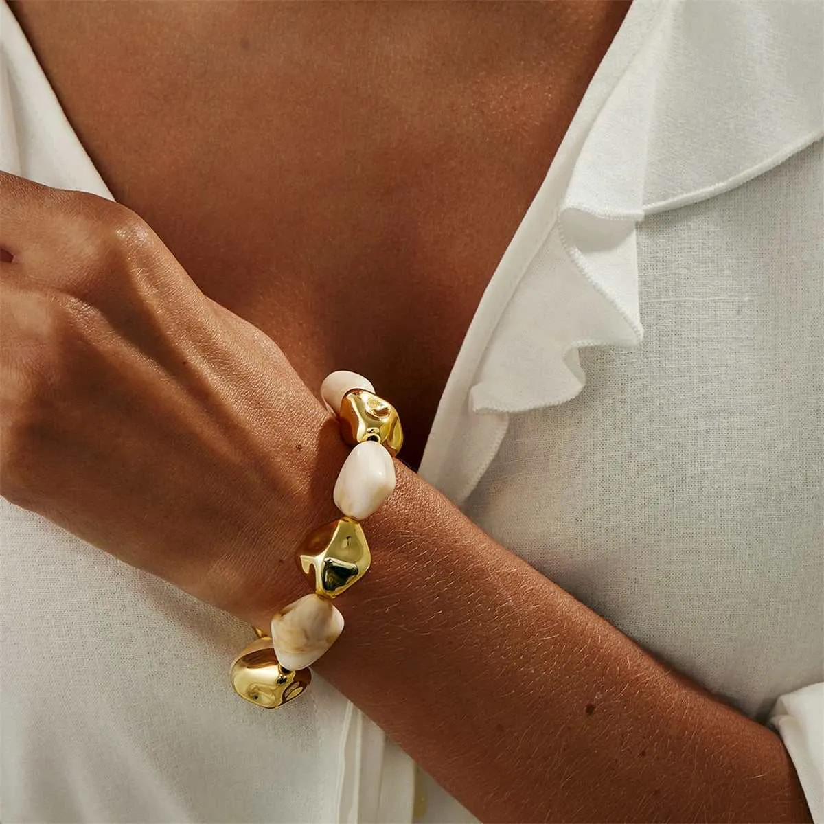 Beige Resin & Goldtone Irregular Beads Station Stretch Bracelet sold by Zulily