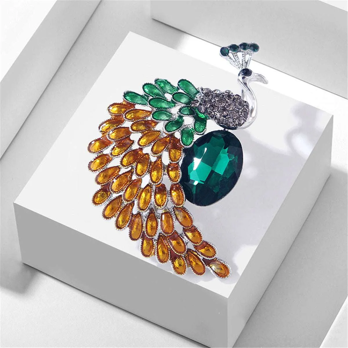 Green & Orange Crystal Peacock Brooch sold by Zulily