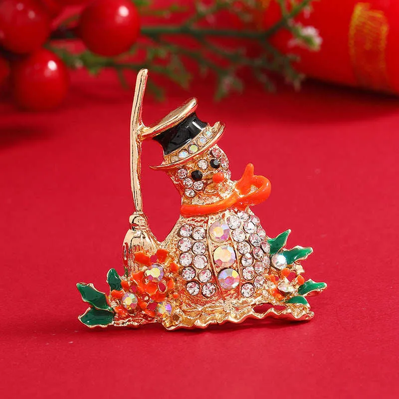 Orange Enamel & Cubic Zirconia Broom Snowman Brooch made by Zulily