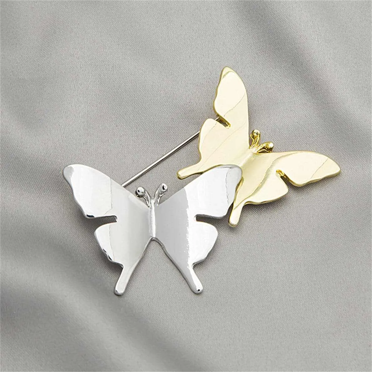 Two-tone Double Butterfly Brooch sold by Zulily