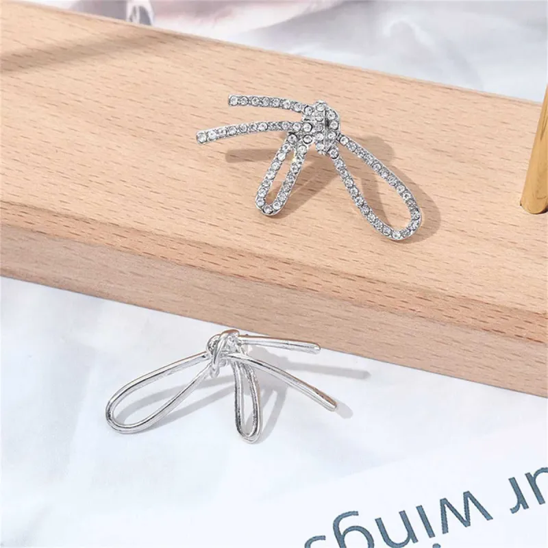 Cubic Zirconia & Silvertone Knot Stud Earrings made by Zulily