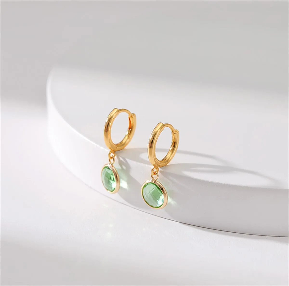 Light Green Crystal & Goldtone Round Huggie Earrings sold by Zulily product image thumbnail 2