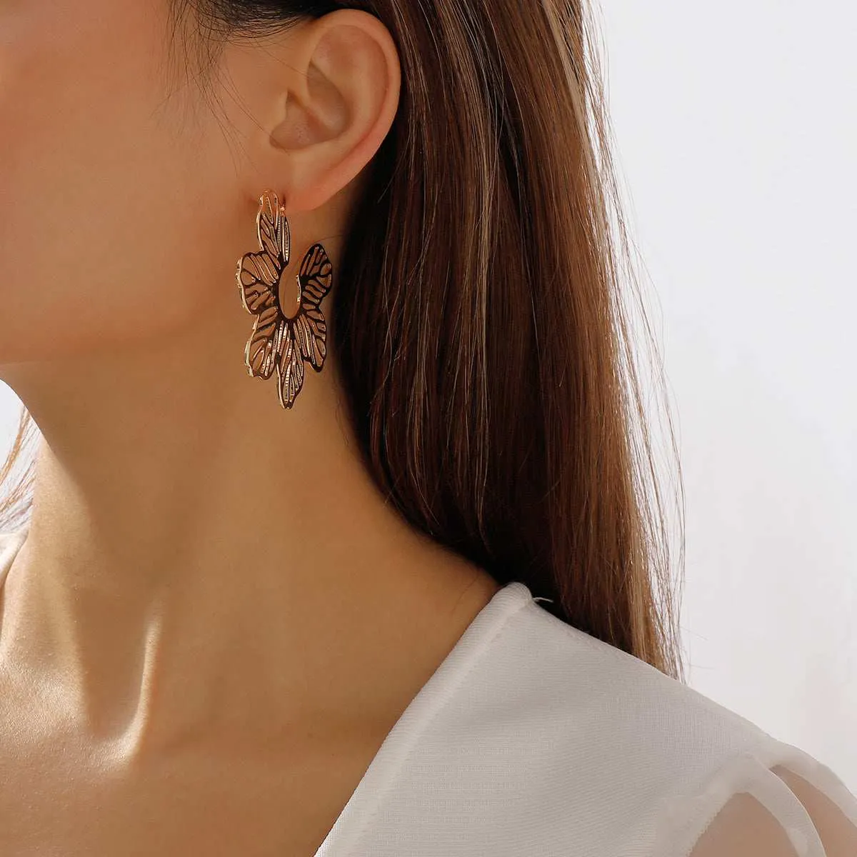 Goldtone Cutout Flower Huggie Earrings sold by Zulily product image thumbnail 2
