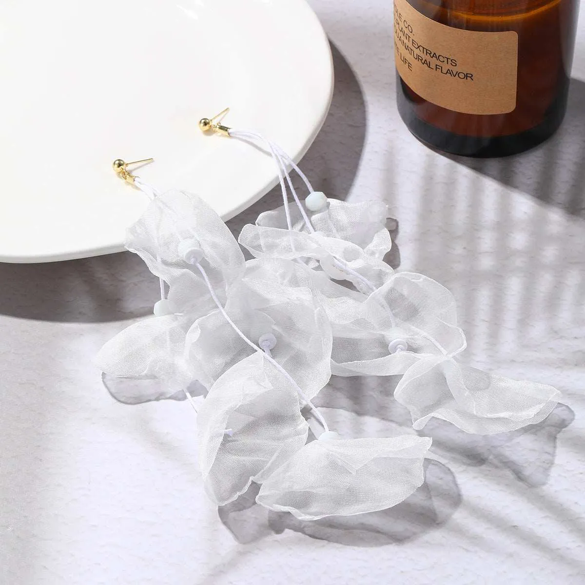 White Polyster & Goldtone Five-Petal Drop Earrings sold by Zulily