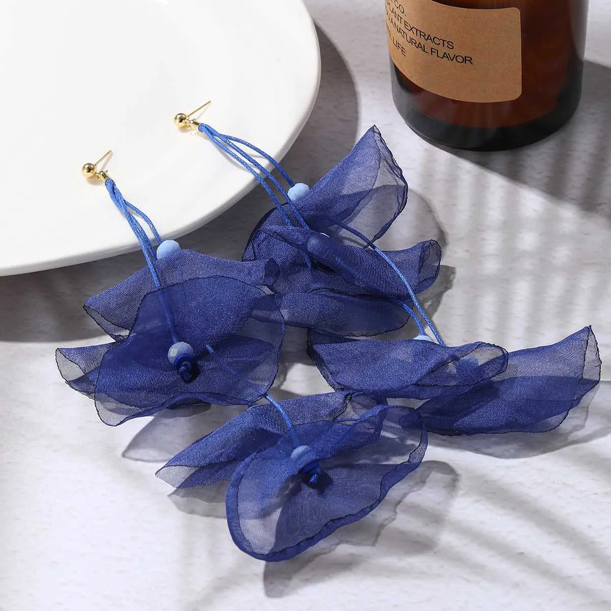 Blue Polyster & Acrylic Goldtone Five-Petal Drop Earrings sold by Zulily