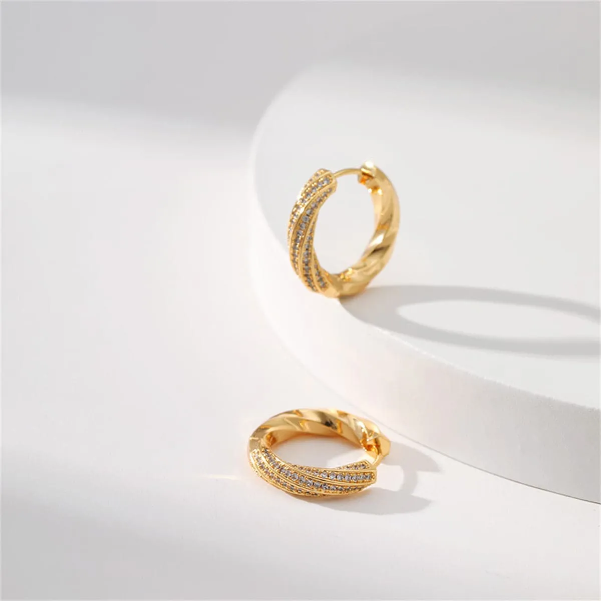 Cubic Zirconia & Goldtone Twisted Huggie Earrings sold by Zulily product image thumbnail 3