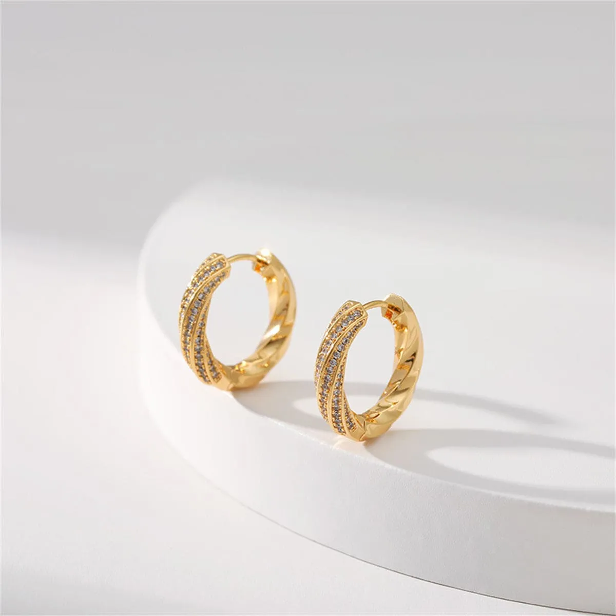 Cubic Zirconia & Goldtone Twisted Huggie Earrings sold by Zulily product image thumbnail 2