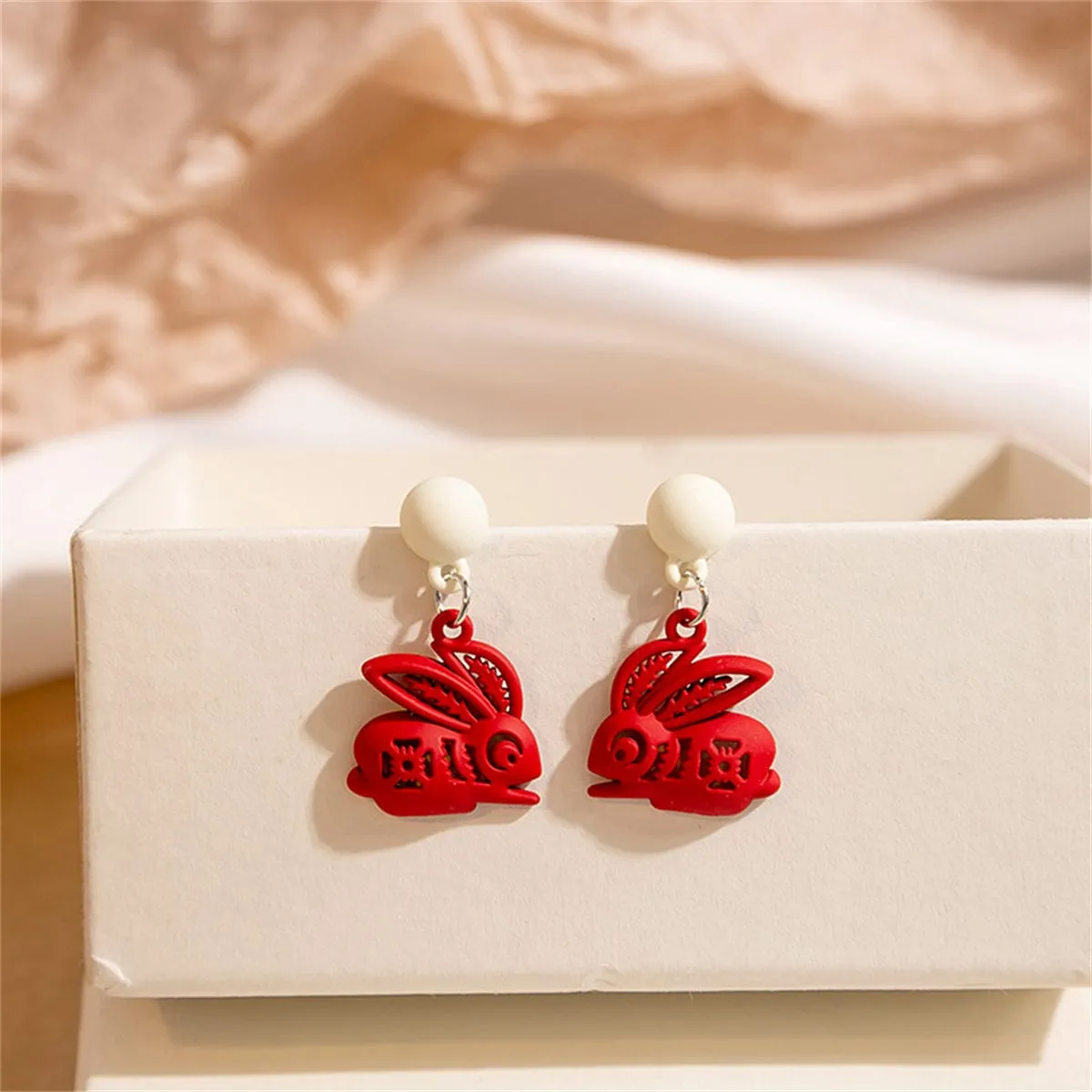 Red Enamel & Silvertone Abstract Rabbit Drop Earrings sold by Zulily
