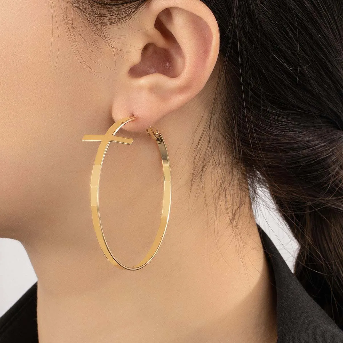 Goldtone Cross Hoop Earrings sold by Zulily