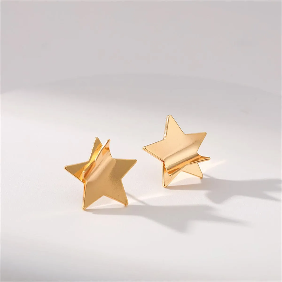 Goldtone Folded Star Stud Earrings sold by Zulily