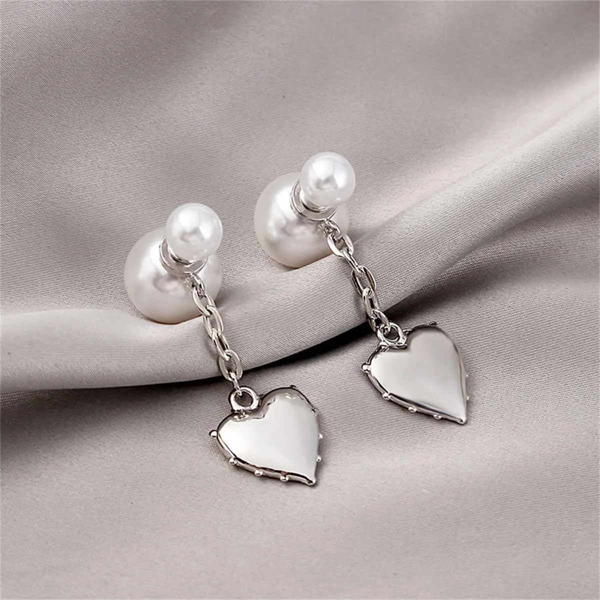 Pearl & Silvertone Heart Drop Ear Jackets sold by Zulily