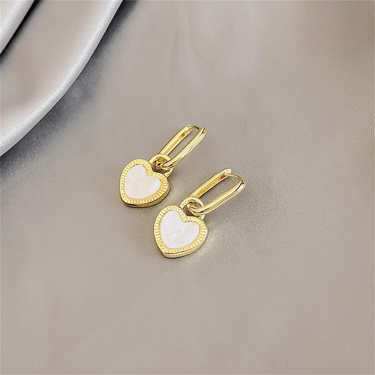 White & Black Heart Huggie Earrings sold by Zulily product image thumbnail 3