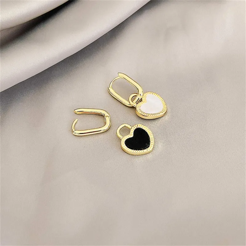 White & Black Heart Huggie Earrings made by Zulily