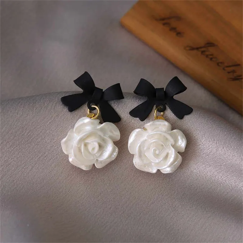 Black Enamel & Resin Goldtone Bow Flower Drop Earrings made by Zulily