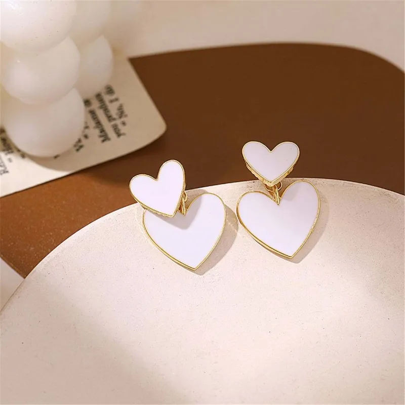 White Enamel & Goldtone Heart Ear Jackets made by Zulily