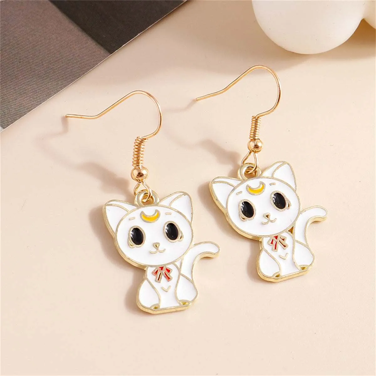 White Enamel & Goldtone Cat Drop Earrings sold by Zulily product image thumbnail 2
