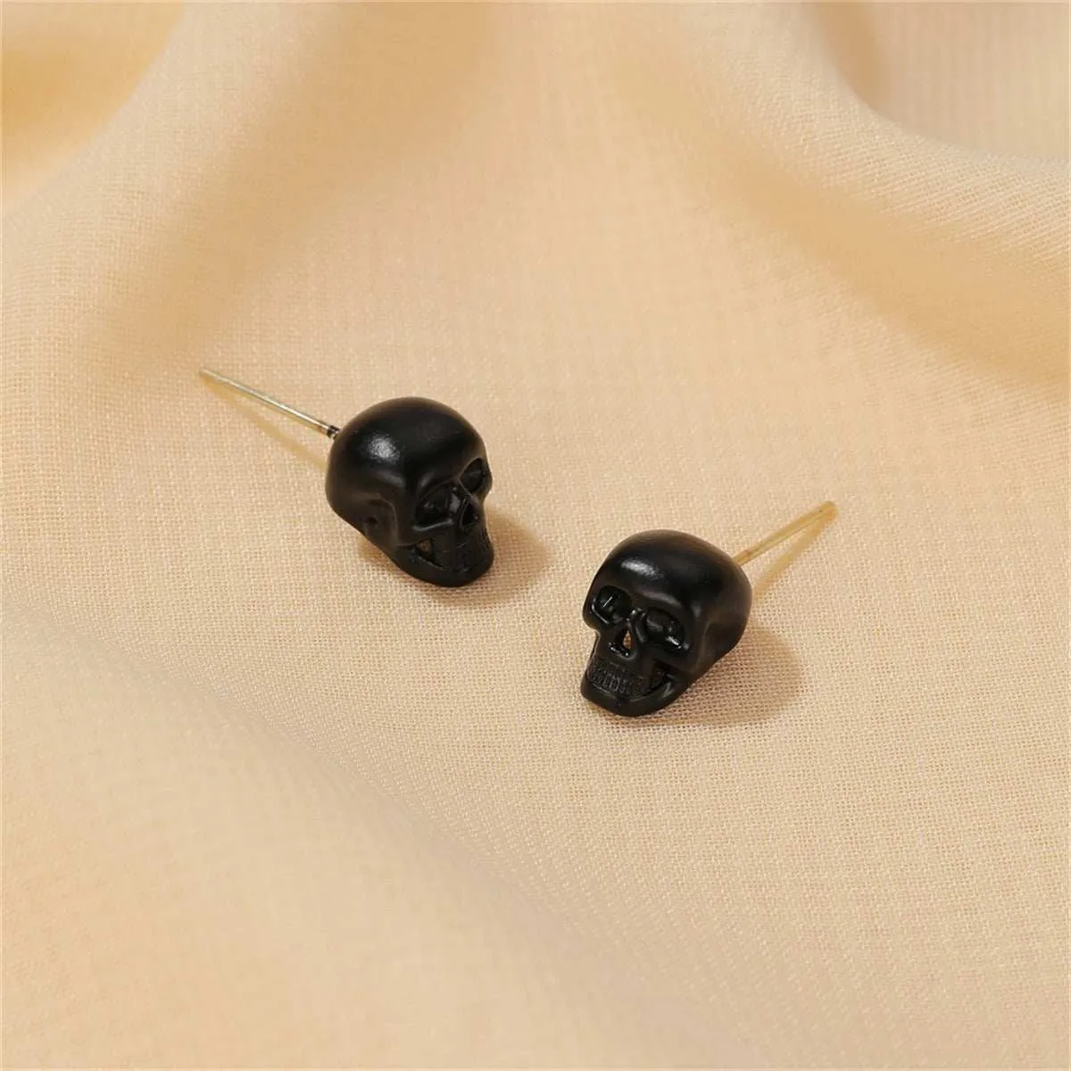 Black Skull Stud Earrings sold by Zulily