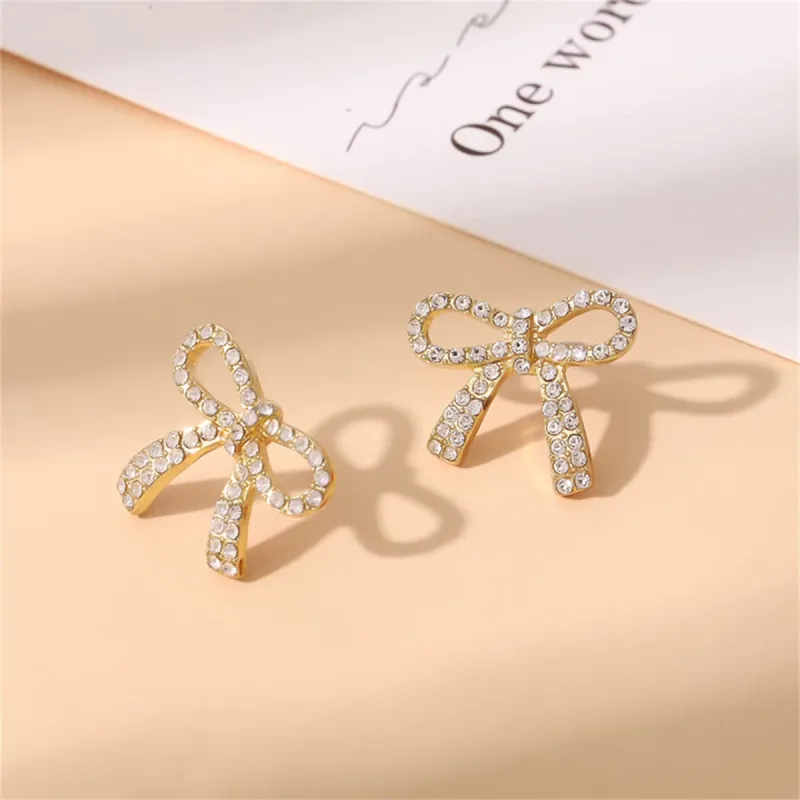 Cubic Zirconia & Goldtone Bow Stud Earring made by Zulily
