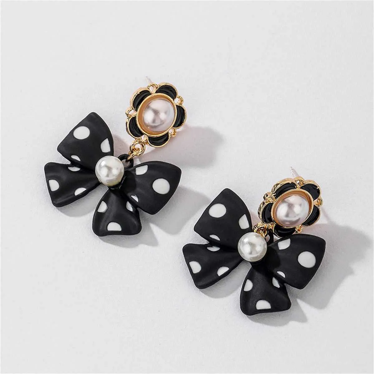 Pearl & Enamel Goldtone Black Bow Drop Earrings sold by Zulily