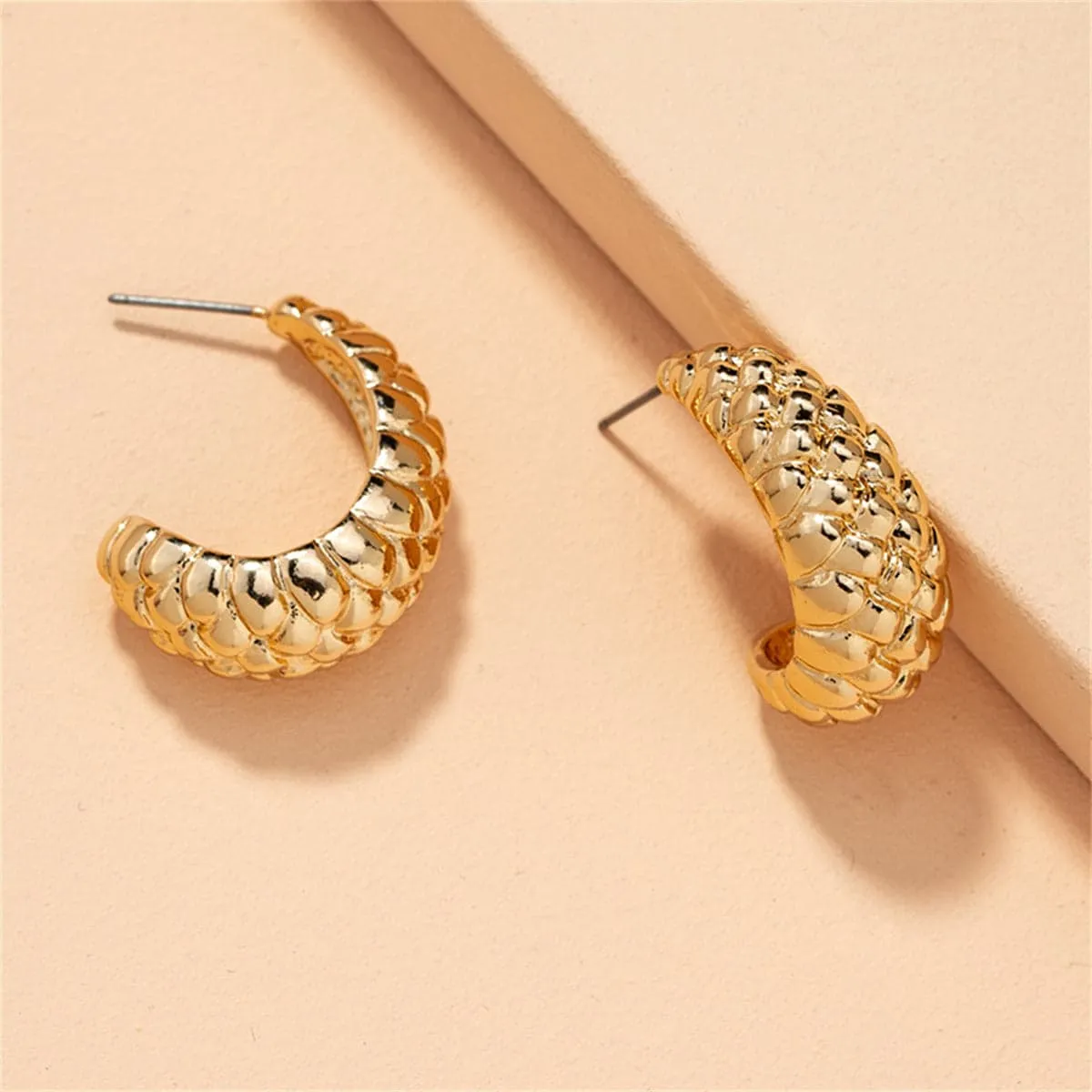 Goldtone Litchin Grain Huggie Earrings sold by Zulily